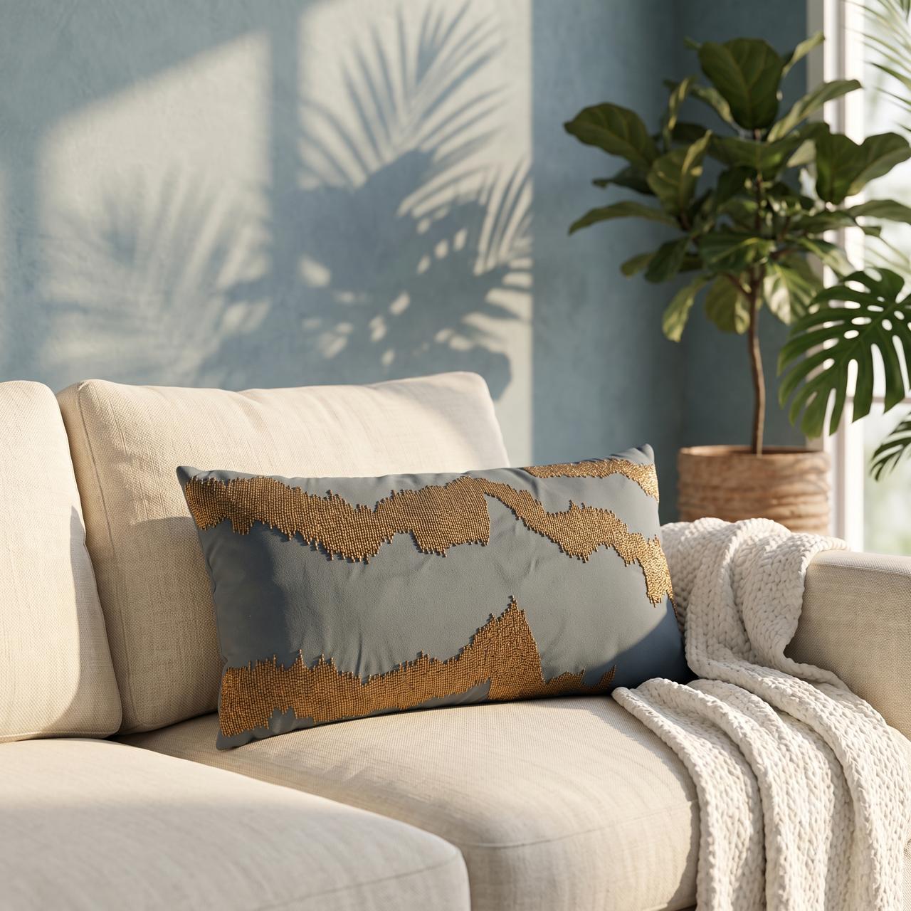 Slate blue lumbar cushion cover with gold wave bead embroidery on sofa